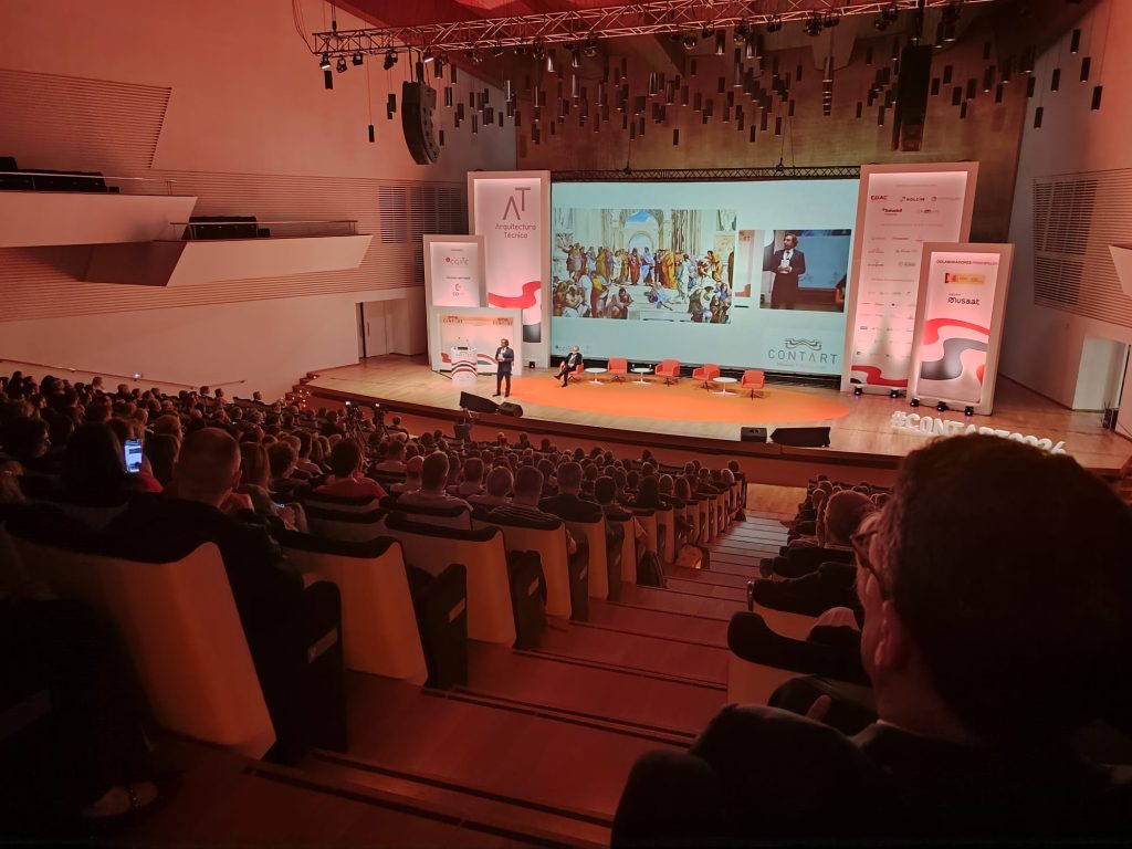 Ponencia institucional de CONTART 2026 con la pintura La Escuela de Atenas de Rafael en pantalla